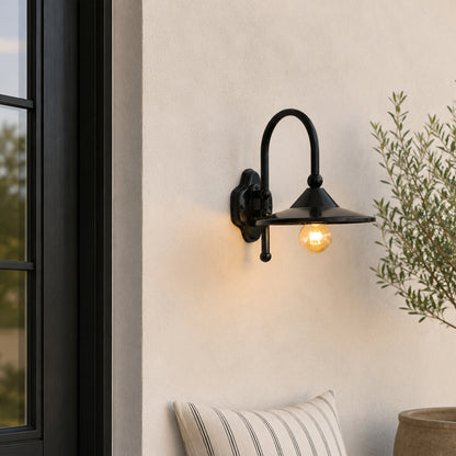 Black metal outdoor wall light lifestyle image with exposed bulb for modern patio and exterior decor.