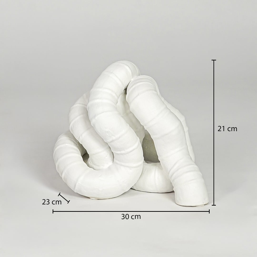 White ceramic abstract decor sculpture size 21 cm height 30 cm width 23 cm depth modern decorative showpiece for table styling.