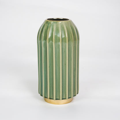 White background image of green gold ceramic vase for elegant tabletop decor styling with modern smooth painted finish.