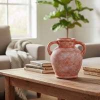 Lifestyle image of peach ceramic handle vase for modern tabletop decor styling with rustic textured finish.
