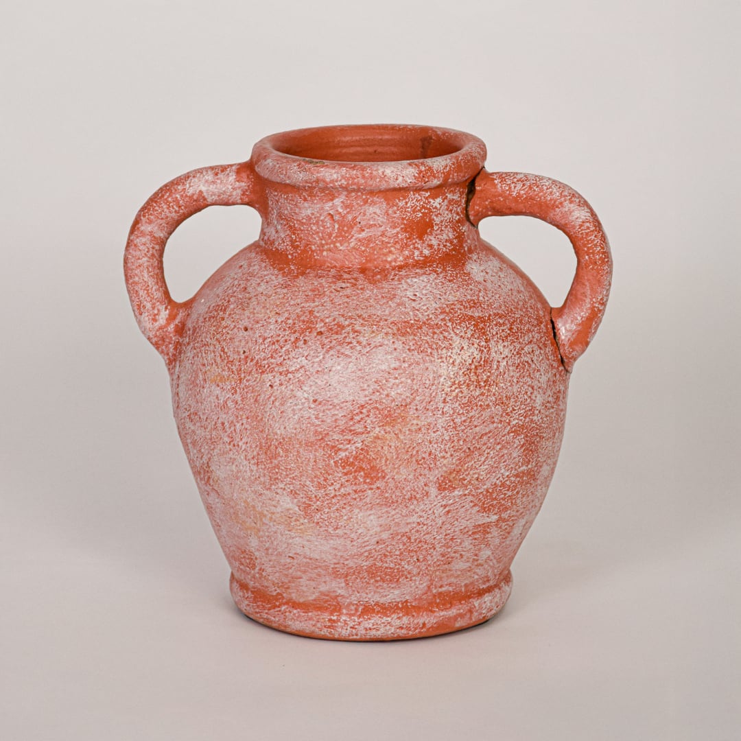 Decorative terracotta ceramic vase with antique white washed texture shown on white background emphasizing artisanal appeal.