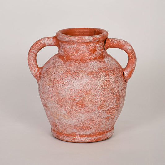 Decorative terracotta ceramic vase with antique white washed texture shown on white background emphasizing artisanal appeal.