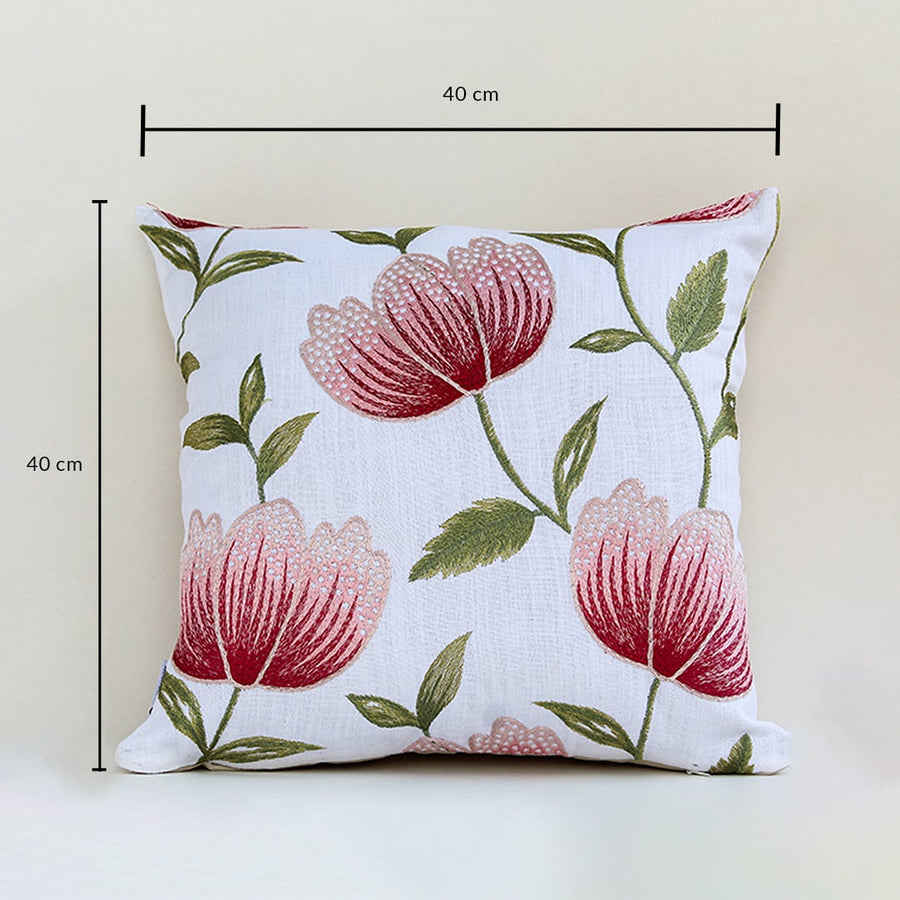 Soft cotton cushion cover with bold red floral embroidery displayed with dimensions of 40 cm by 40 cm providing a bright nature inspired décor touch with a breathable gentle and skin friendly fabric texture.