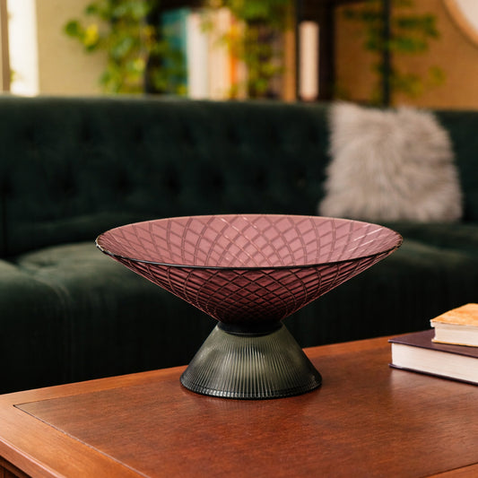Smoky pink glass decorative bowl styled on a coffee table for elegant modern tabletop decor and home interiors.