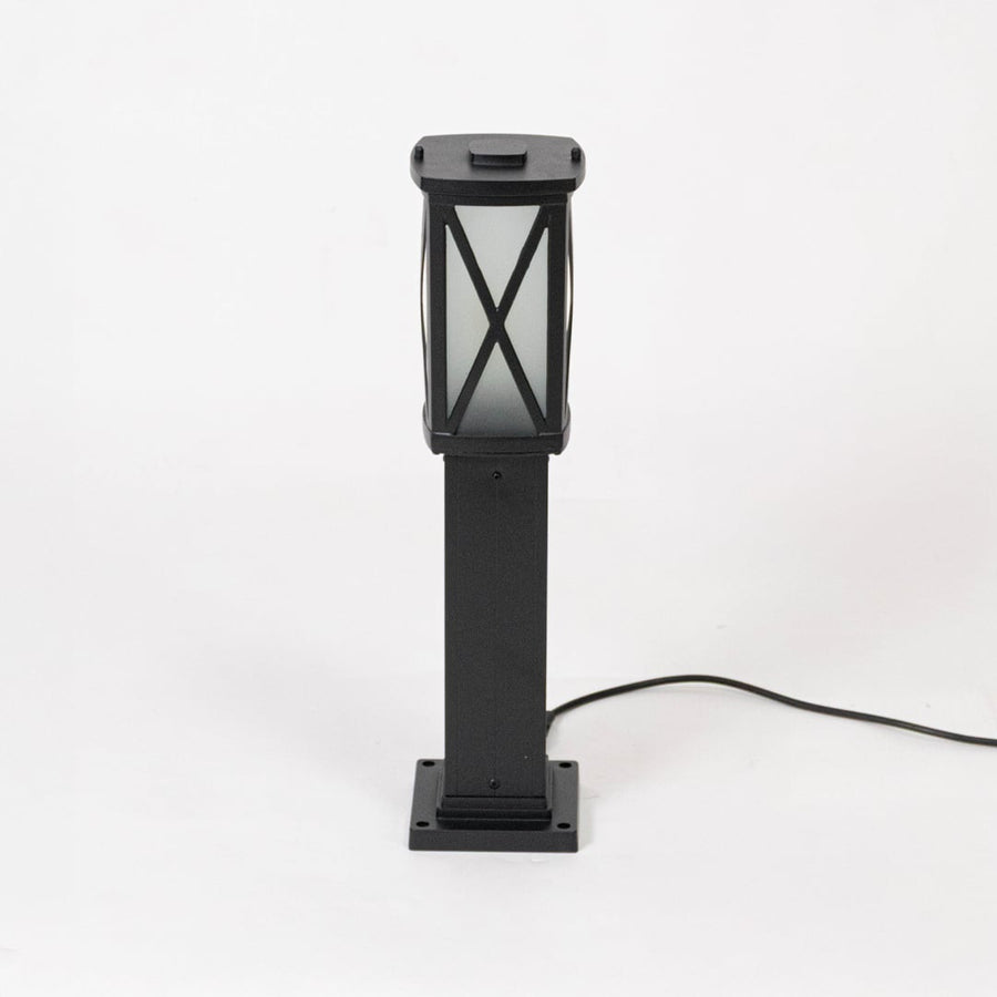 Classic outdoor pillar light with black frame and frosted glass displayed off on plain white background.