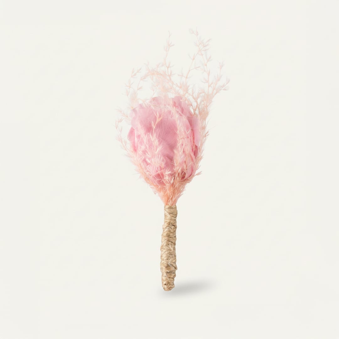 Dried floral stem bouquet with soft pink bloom and feathery textures on white background showcasing delicate handcrafted beauty and minimal decor styling appeal.