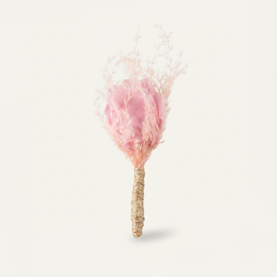 Dried floral stem bouquet with soft pink bloom and feathery textures on white background showcasing delicate handcrafted beauty and minimal decor styling appeal.
