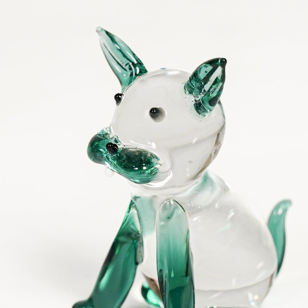crystal glass cute lying cat blue closeup