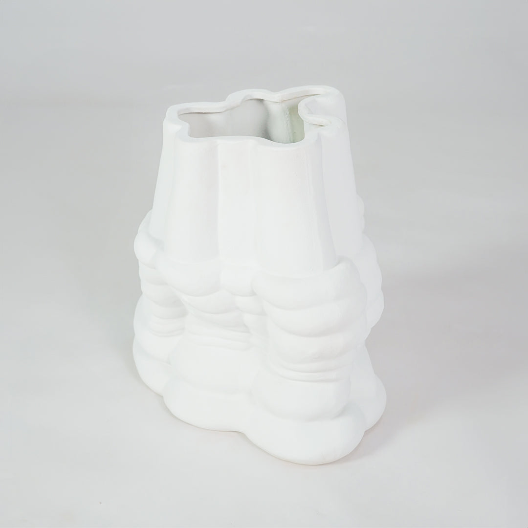 White textured ceramic decorative vase on white background for stylish contemporary home decor styling.