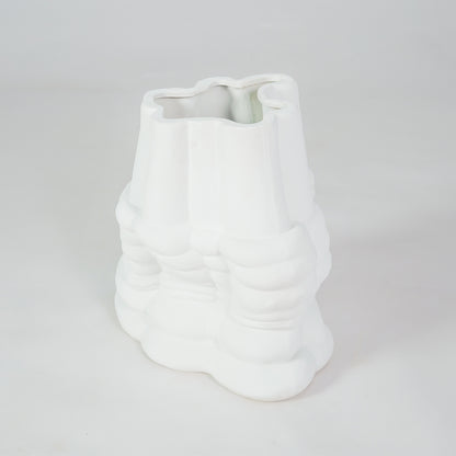 White textured ceramic decorative vase on white background for stylish contemporary home decor styling.