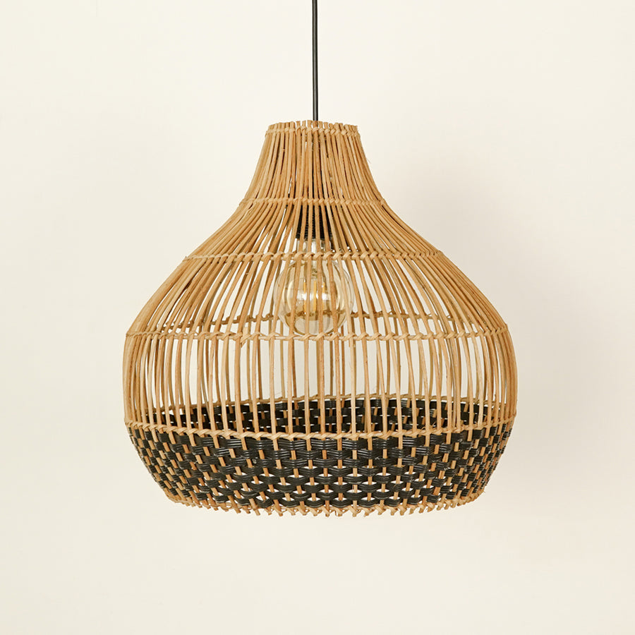 Natural and black rattan pendant light with woven design for stylish dining room ceiling placement.