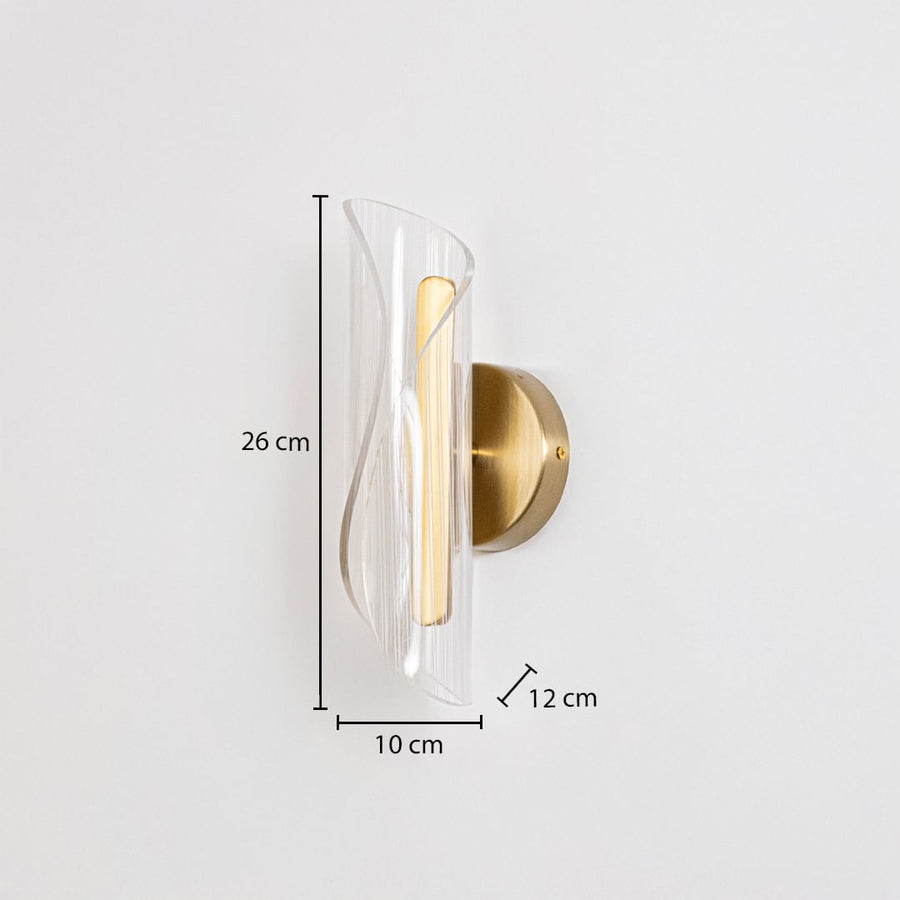 Gold wall light with sculpted clear glass shade shown with 26 cm height and 10 cm width for accurate sizing.
