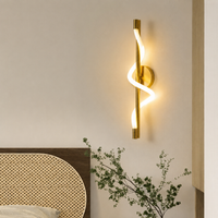 Modern gold brass spiral wave LED wall sconce light for bedroom bedside headboard living room luxury home interior decor.