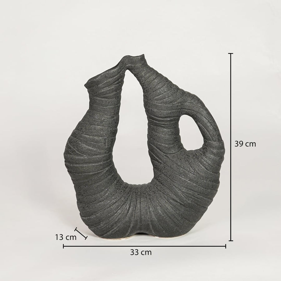 Dimension image of a textured charcoal black ceramic arch sculpture vase with open cutouts showing 39 cm height and 33 cm width.