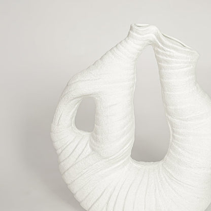 White ceramic abstract sculptural vase with detailed textured surface perfect for artistic dried floral display and elegant interior decor.