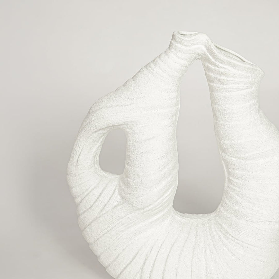 White ceramic abstract sculptural vase with detailed textured surface perfect for artistic dried floral display and elegant interior decor.