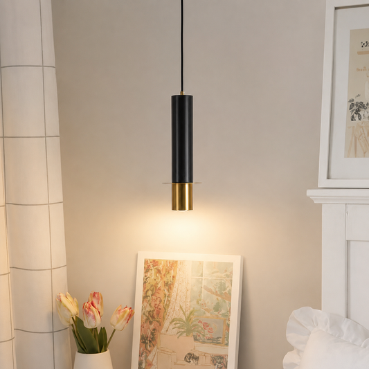 Lifestyle image of black cylindrical marble pendant lamp for elegant kitchen decor styling and modern home lighting.