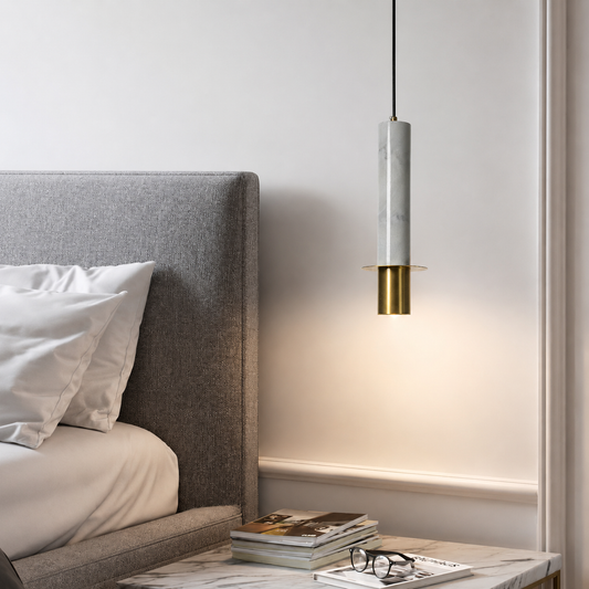Lifestyle image of white cylindrical marble pendant lamp for elegant dining room decor styling and modern home lighting.
