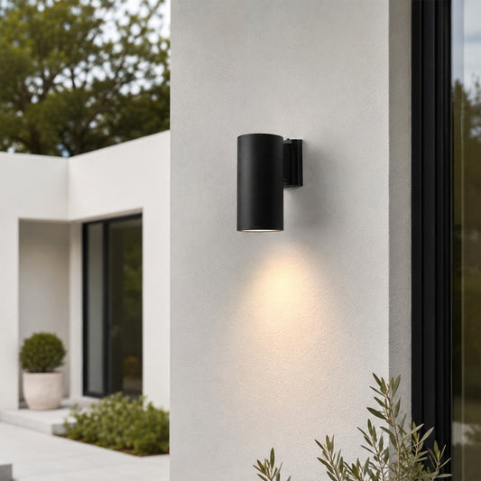 Black metal outdoor wall light lifestyle image with upward downward glow for modern exterior wall decor.