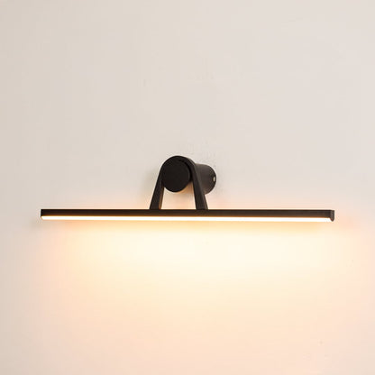 Black metal picture light switched on over white background spreading soft warm glow ideal for gallery wall lighting.