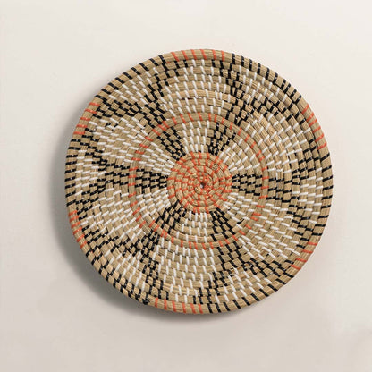 Natural woven decorative wall basket with floral pattern and terracotta accents for elegant wall styling and home decor.
