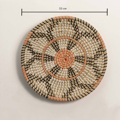 Dimension image of handcrafted natural seagrass wall basket with black and orange geometric floral pattern for boho decor.
