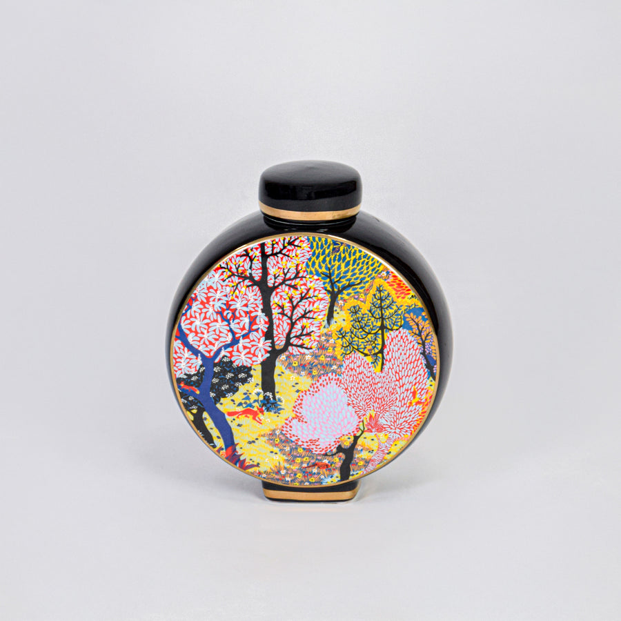 Round ceramic decorative jar with colorful tree design for elegant tabletop styling and luxury home decor displays.