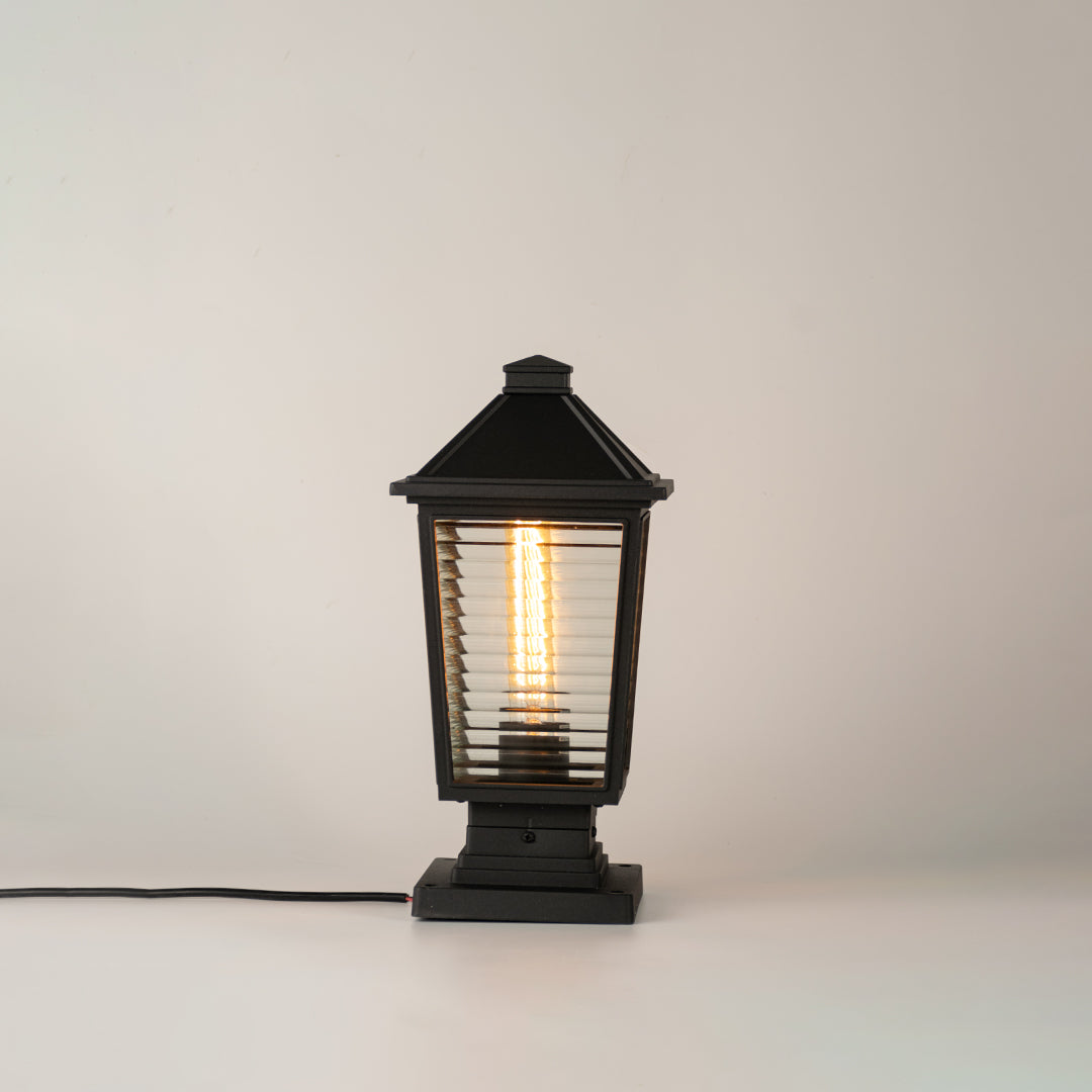 Modern black outdoor gate light with glowing bulb for stylish exterior decor styling use.