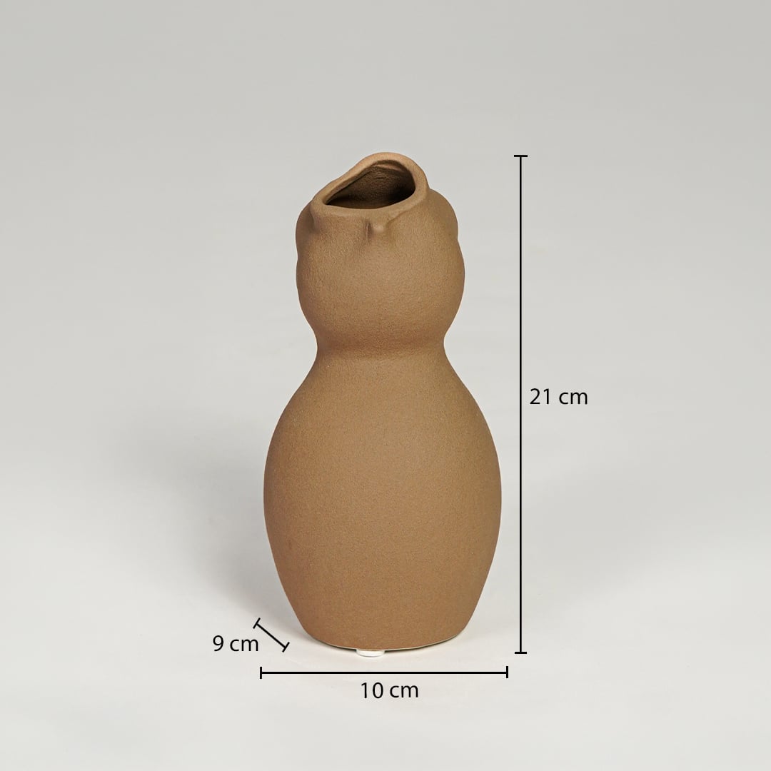 Brown ceramic sculpted vase measuring 21 cm height 10 cm width and 9 cm depth perfect for shelf or console decor placement.