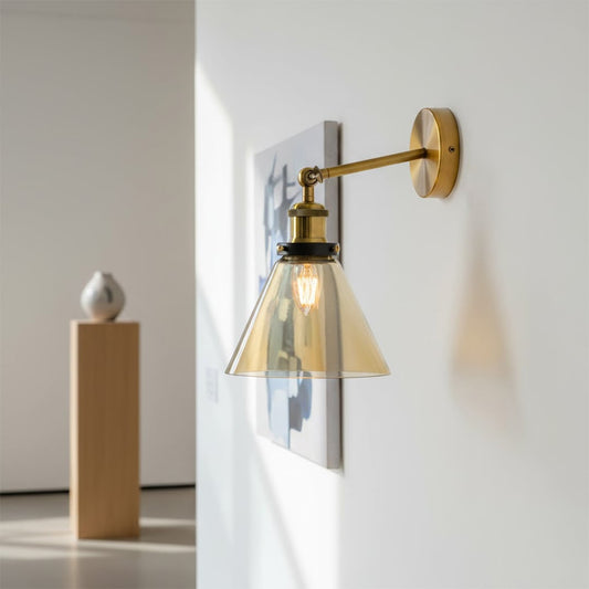 Modern gold metal wall light with clear glass shade for elegant hallway and luxury decor styling spaces.