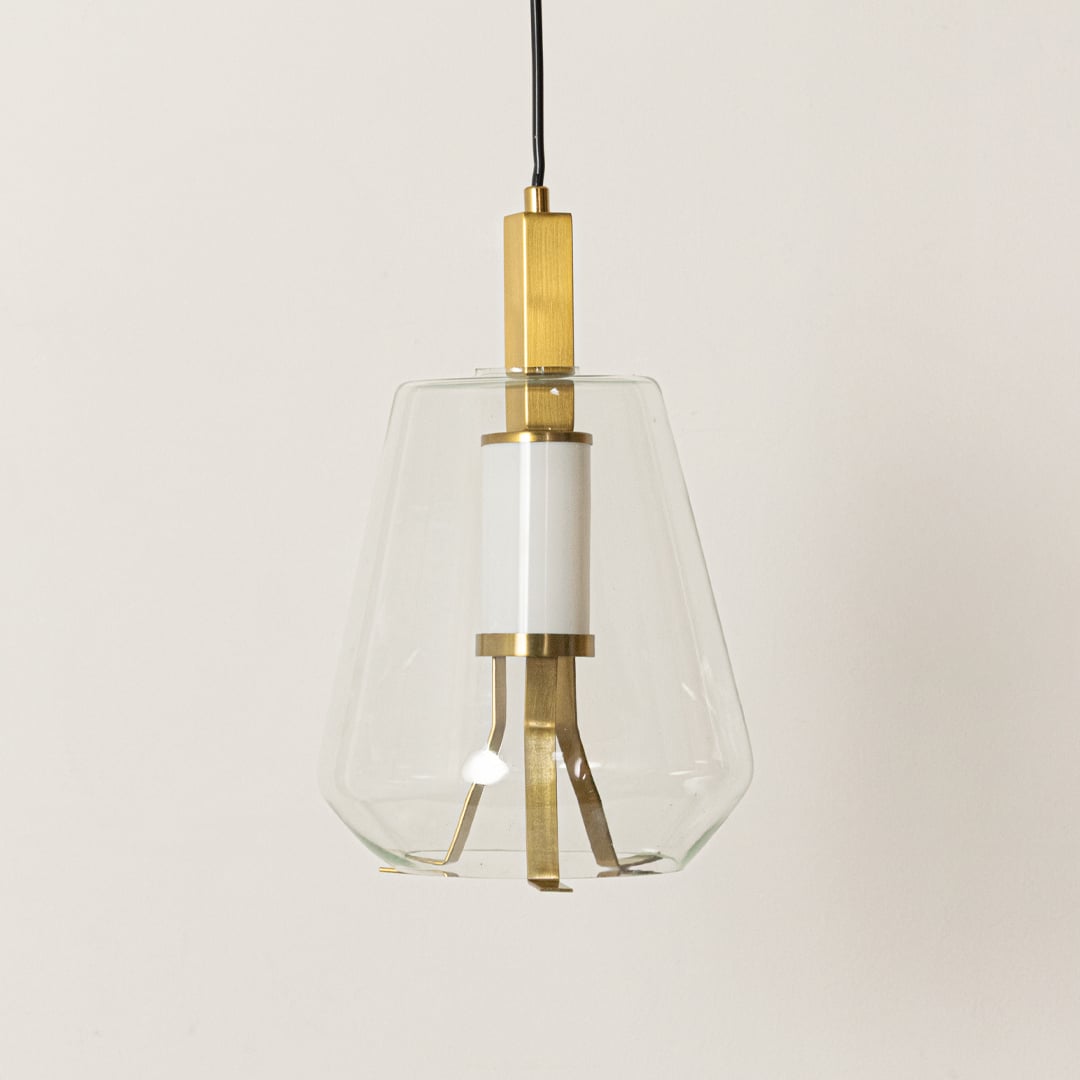 Clear glass and gold metal pendant light designed for stylish dining room and kitchen decor.