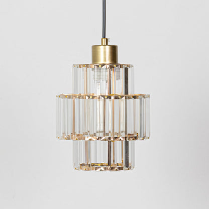 Crystal and gold metal pendant light designed for luxurious dining room and living room decor.