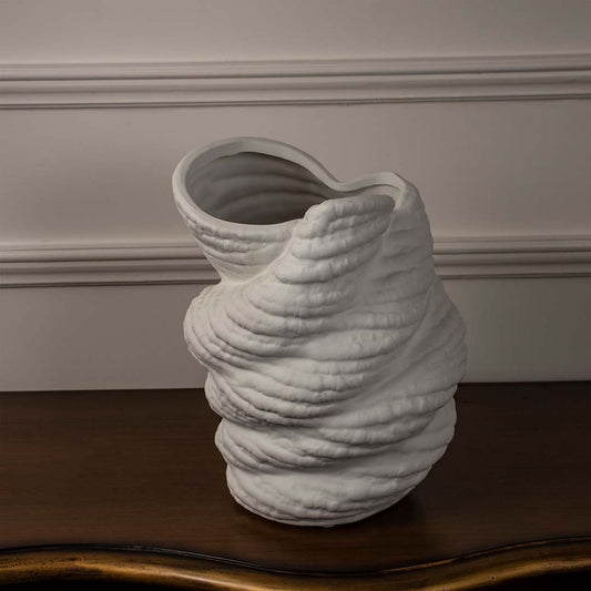 White ceramic sculptural vase with textured artistic design styled for contemporary living room and modern interior decor.