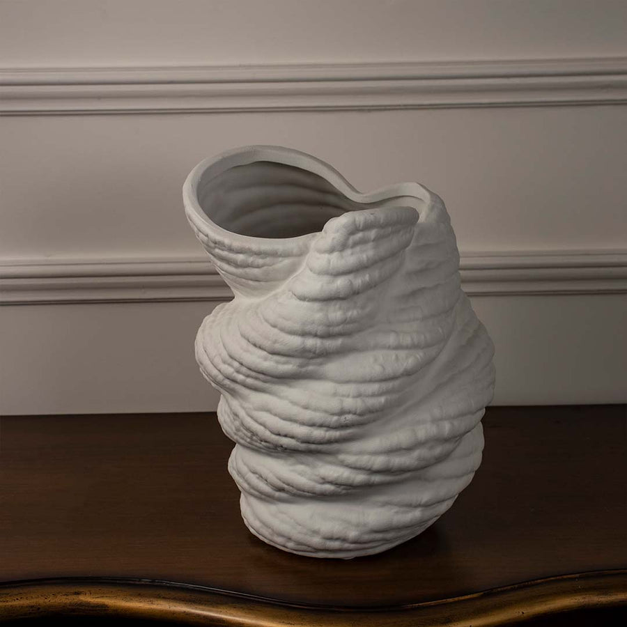 White ceramic sculptural vase with textured artistic design styled for contemporary living room and modern interior decor.