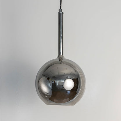Chrome glass globe pendant light displayed unlit on white background showcasing reflective finish for contemporary ceiling decor.