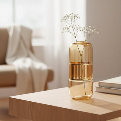 Amber glass decorative vase styled on a side table adding warmth to elegant modern home decor settings.