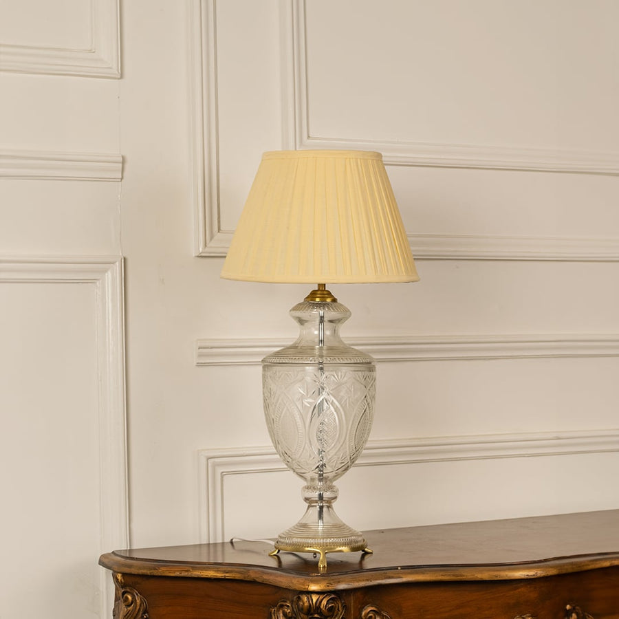 Clear etched glass table lamp with pleated fabric shade designed for timeless classic decor and ambient table lighting.