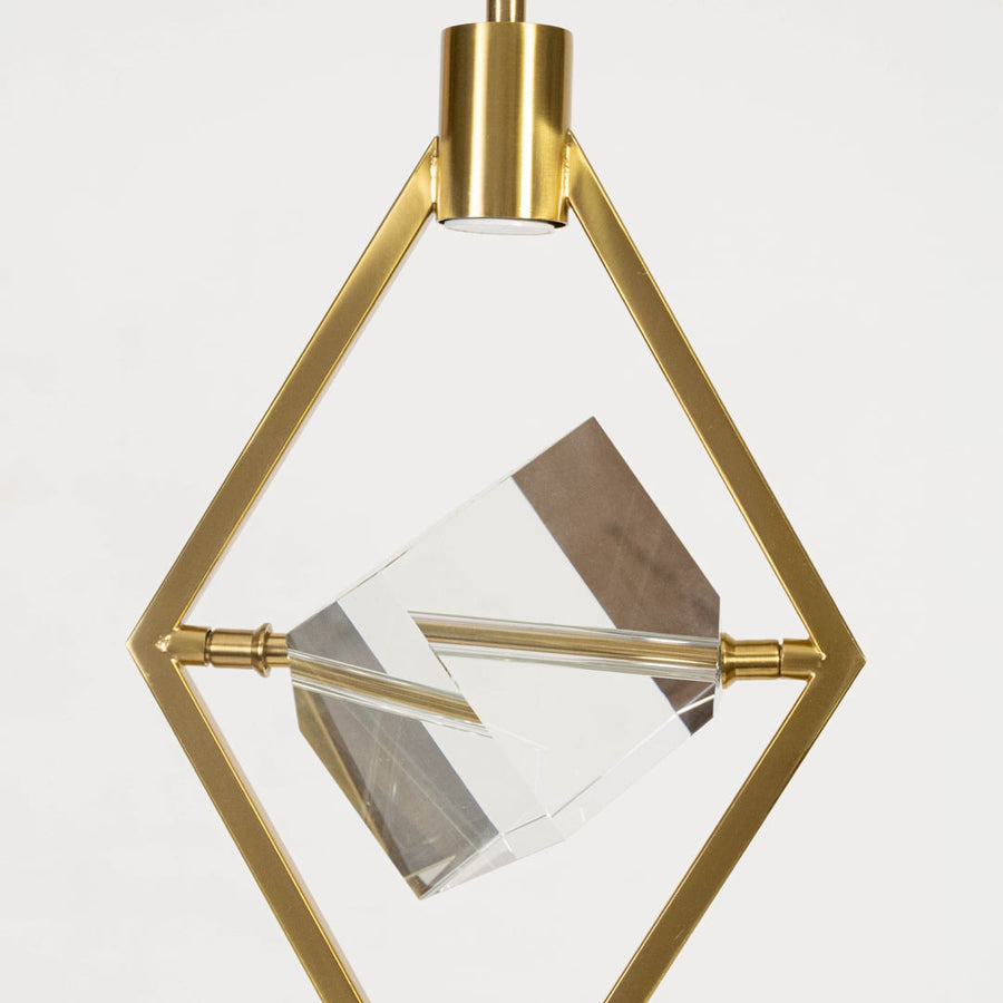 Closeup of pendant light with golden diamond frame and crystal centerpiece elegant ceiling lamp design.