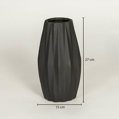 Black ceramic decorative vase showing 27 cm height and 15 cm width suitable for table shelf or console placement.