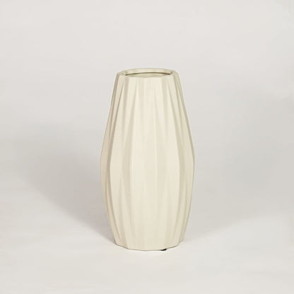 Modern beige ceramic fluted decorative vase ideal for dried flower arrangement on console table shelf and stylish home decor.