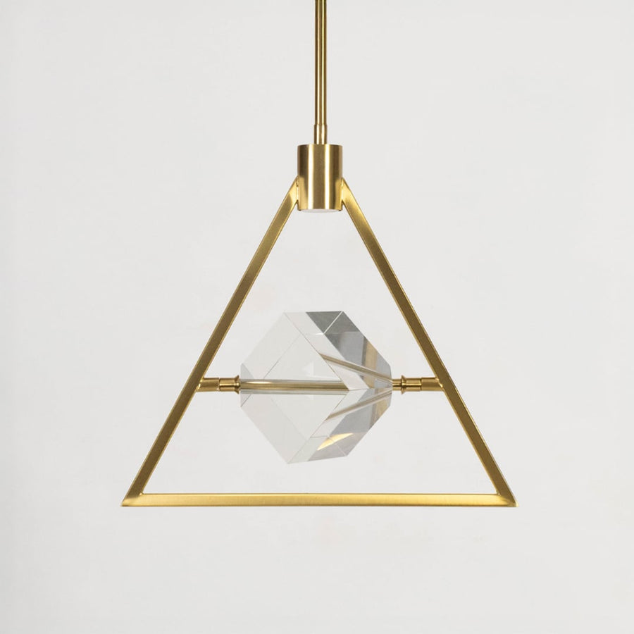 Pendant light with golden triangular frame and clear crystal centerpiece shown off on white background.
