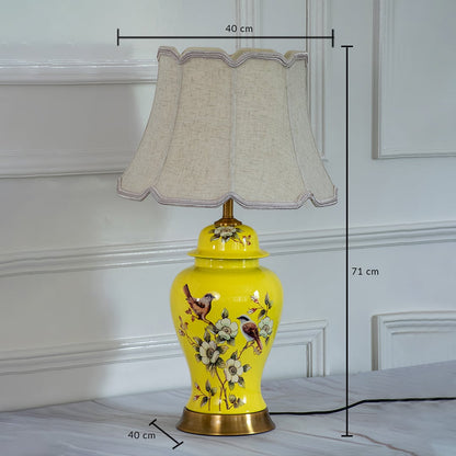 Decorative ceramic table lamp with yellow base and pleated shade showing 45 cm height and 30 cm shade width for interior lighting.
