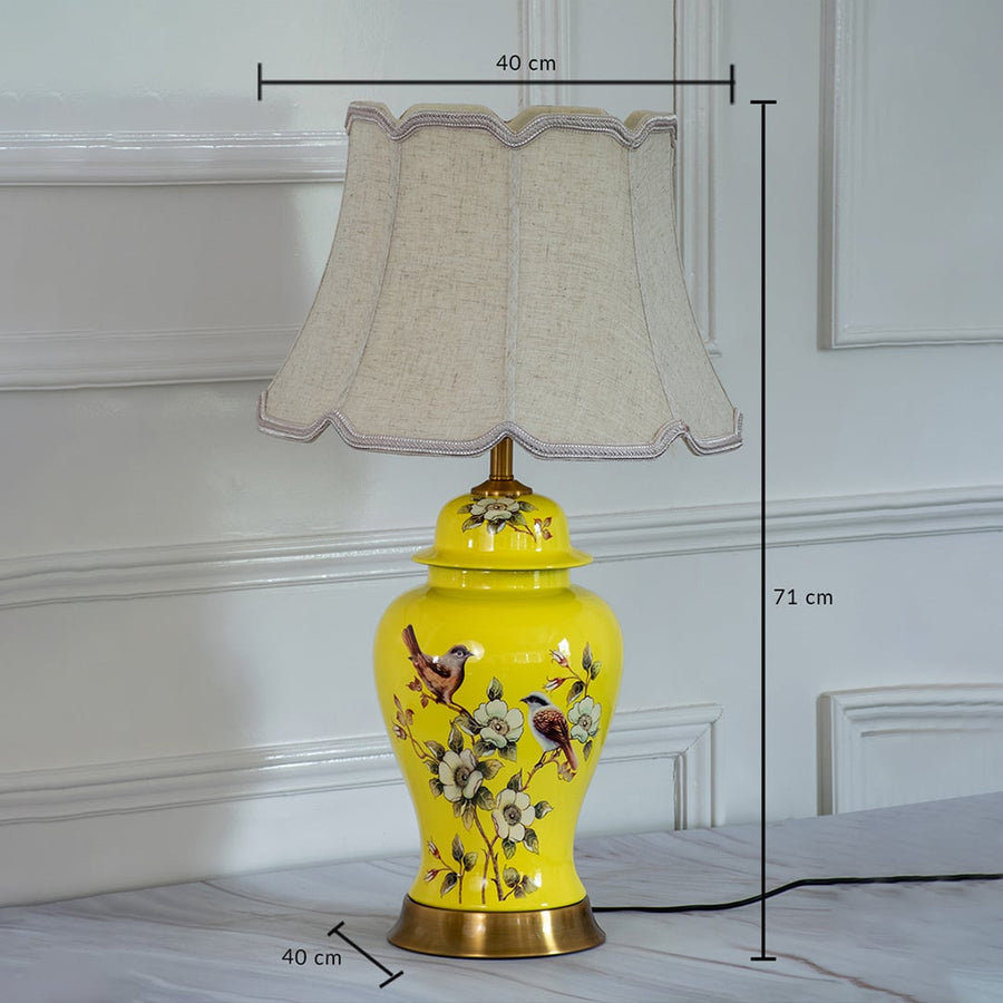 Decorative ceramic table lamp with yellow base and pleated shade showing 45 cm height and 30 cm shade width for interior lighting.