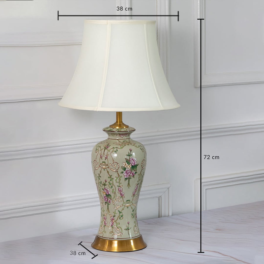 Ceramic table lamp with floral artwork shown with 72 cm height and 38 cm width measurements for home decor styling.