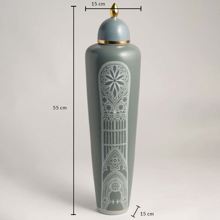 Green ceramic jar with golden lid and white design shown with 55 cm height and 15 cm width for decor placement.