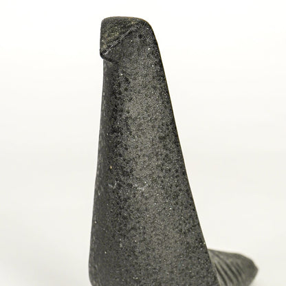 Closeup of dark grey ceramic abstract animal decor sculpture showing textured finish and sculpted form.