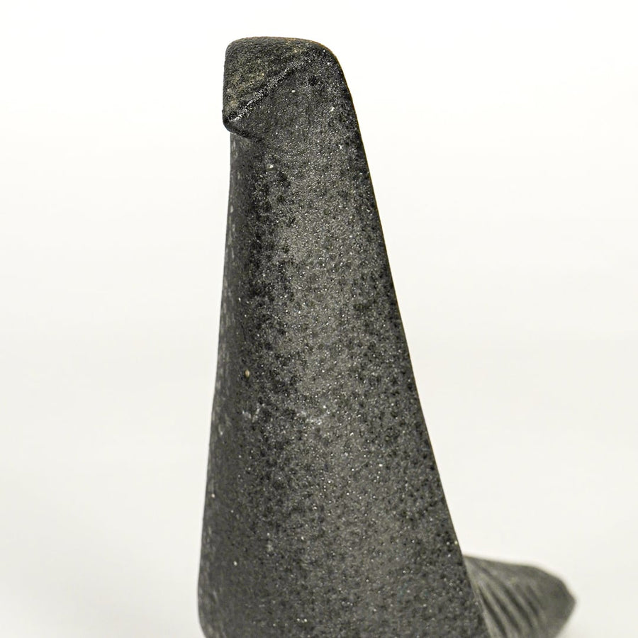 Closeup of dark grey ceramic abstract animal decor sculpture showing textured finish and sculpted form.
