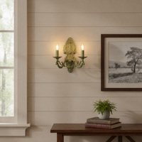 Lifestyle image of distressed green cast aluminium candelabra wall sconce for elegant rustic living room decor styling.