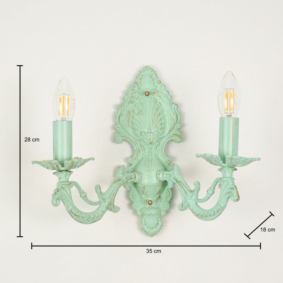 Dimension image of distressed green cast aluminium candelabra wall sconce for elegant rustic living room decor styling.