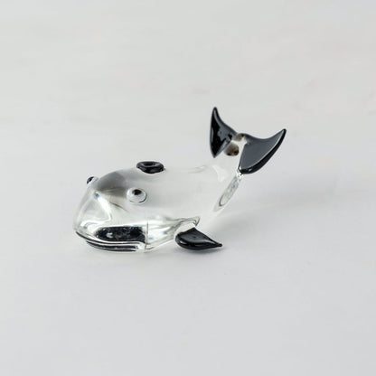 Transparent glass fish decor sculpture with black detailing for elegant tabletop and modern home decor placement.